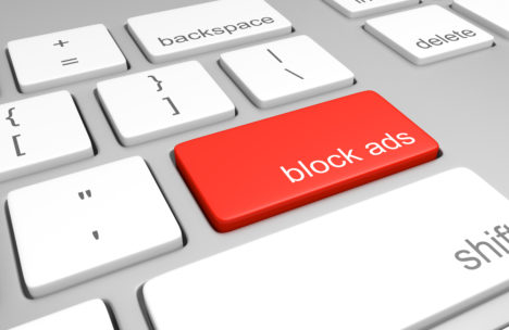 Ad blocking key on computer keyboard for stopping internet advertising