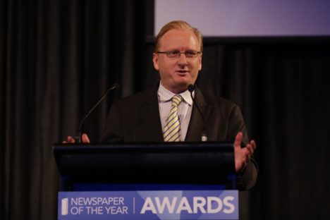 The Australian's Paul Whittaker accepts the newspaper of the year title