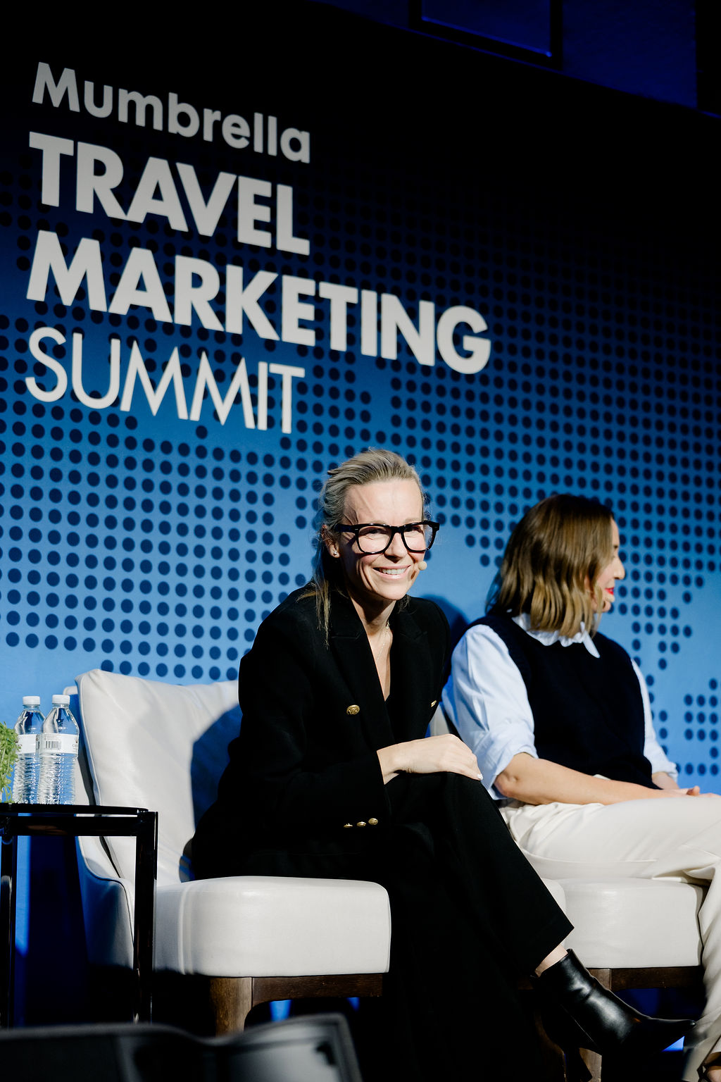Sarah Stinson on stage at the Mumbrella Travel Marketing Summit